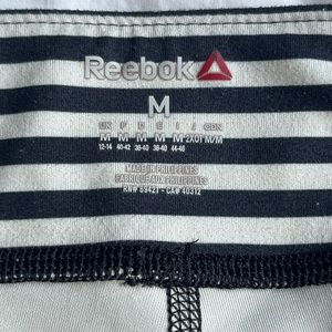 Reebok black and white striped capri size medium
